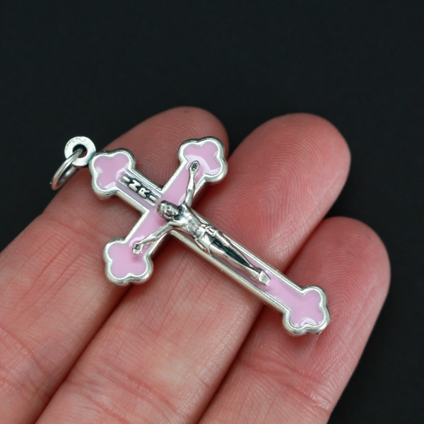 Orthodox Byzantine die-cast metal crucifix with a soft pink/mauve enamel inlay
