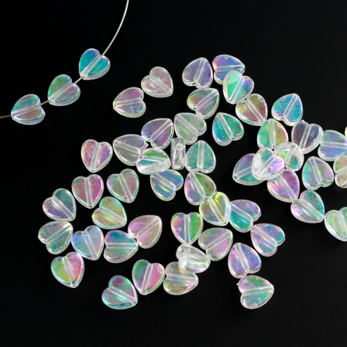 Acrylic AB (aurora borealis) clear transparent beads that are are heart shaped