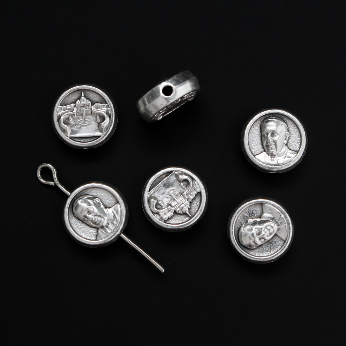 Metal spacer beads that depict an image of Pope Francis on the front and the Vatican (St. Peter's Basilica) on the back