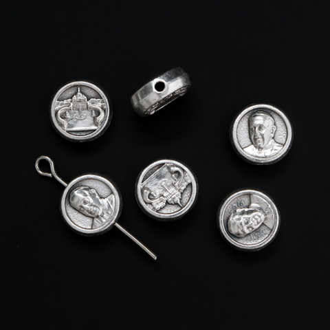 Metal spacer beads that depict an image of Pope Francis on the front and the Vatican (St. Peter's Basilica) on the back
