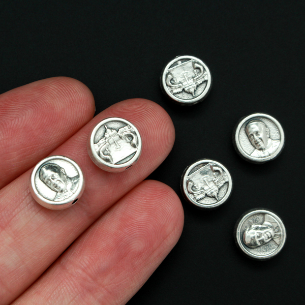 Metal spacer beads that depict an image of Pope Francis on the front and the Vatican (St. Peter's Basilica) on the back