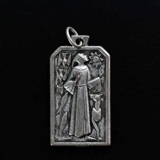 Unique rectangle-shaped pendant depicting Saint Francis surrounded by animals. Marked "Pray For Us" on the back