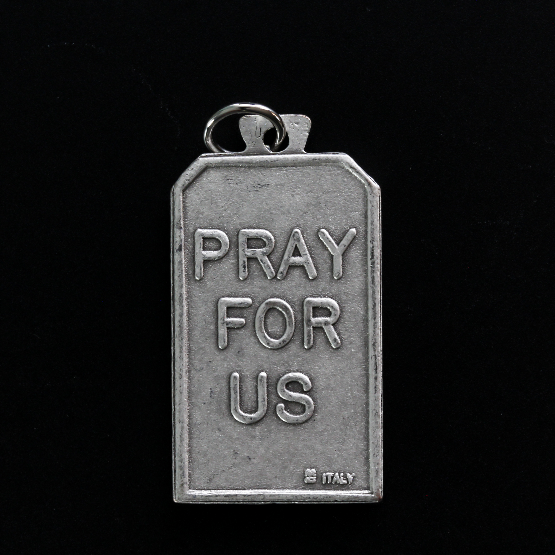 Unique rectangle-shaped pendant depicting Saint Michael defeating Satan. Marked "Pray For Us" on the back