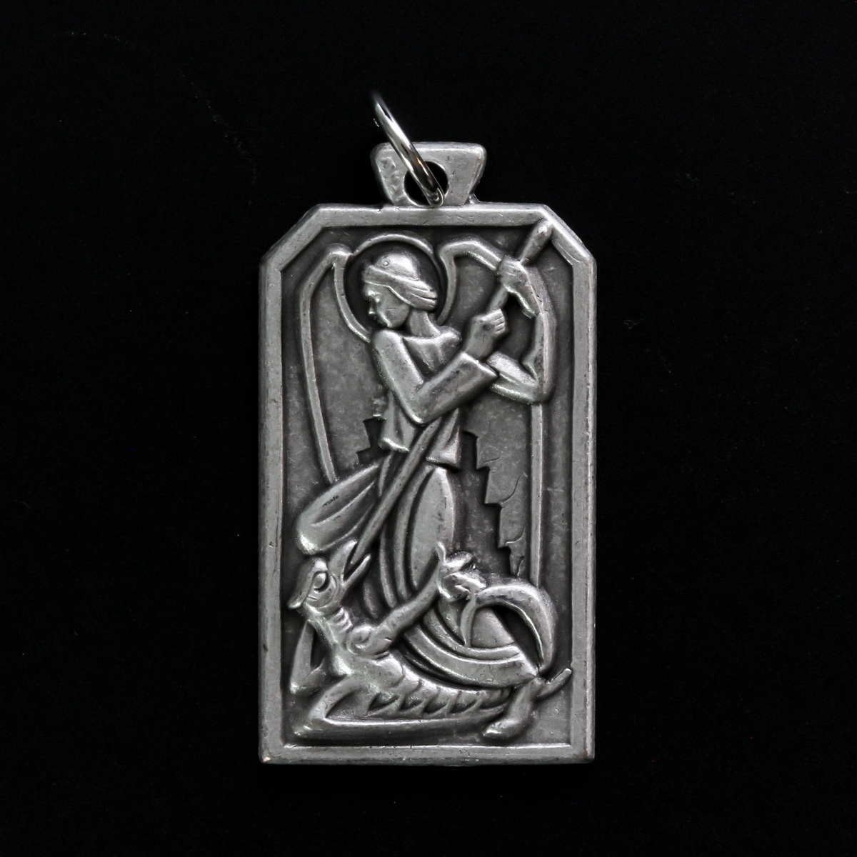 Unique rectangle-shaped pendant depicting Saint Michael defeating Satan. Marked "Pray For Us" on the back