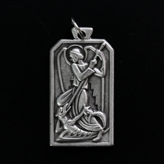 Unique rectangle-shaped pendant depicting Saint Michael defeating Satan. Marked "Pray For Us" on the back