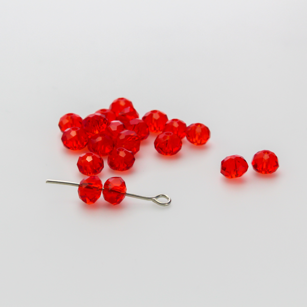 Asian cut crystal glass beads. 6mm x 4mm faceted red transparent. Sold in packages of 60 beads
