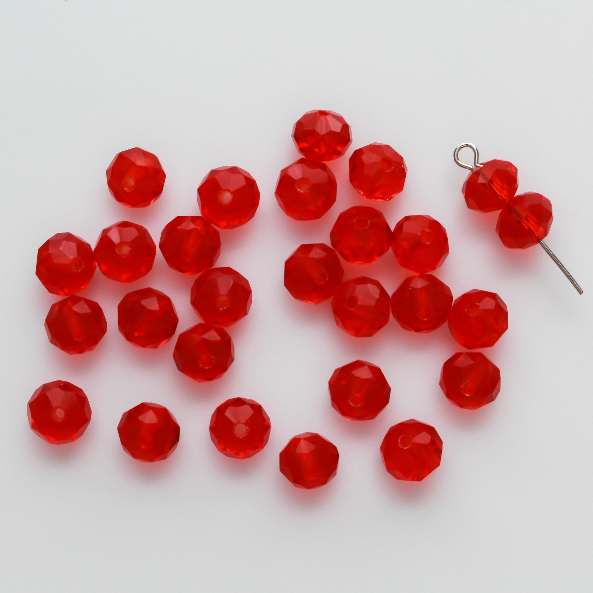 Asian cut crystal glass beads. 8mm x 6.2mm rondelle faceted red transparent. Sold in packages of 60 beads