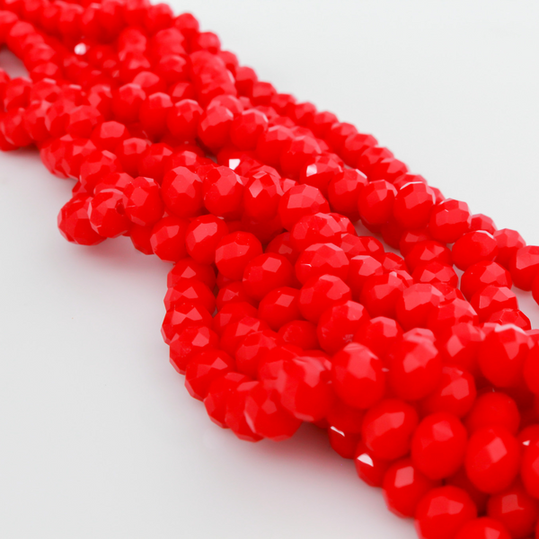 Glass faceted rondelle beads in an fire brick red color.
