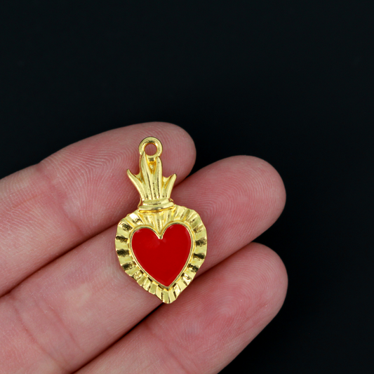 Sacred Heart Ex Voto charms that are a shiny gold color with red enamel detail.
