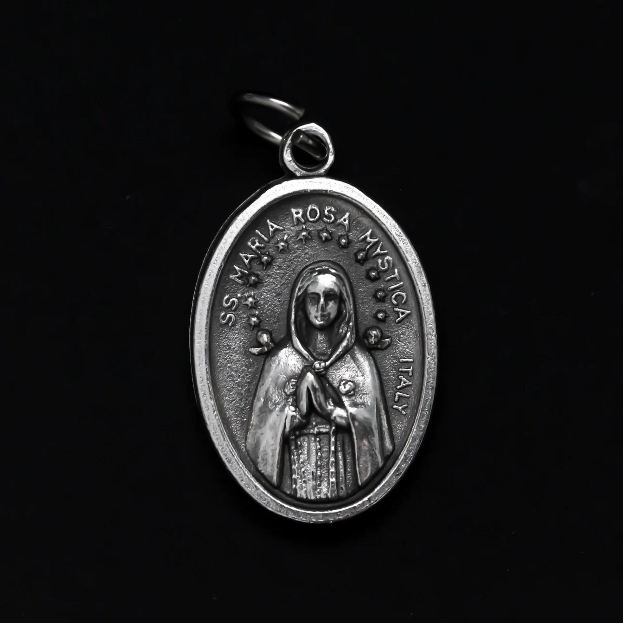 Maria Rosa Mystica medal that is marked "Pray for us" on the backside