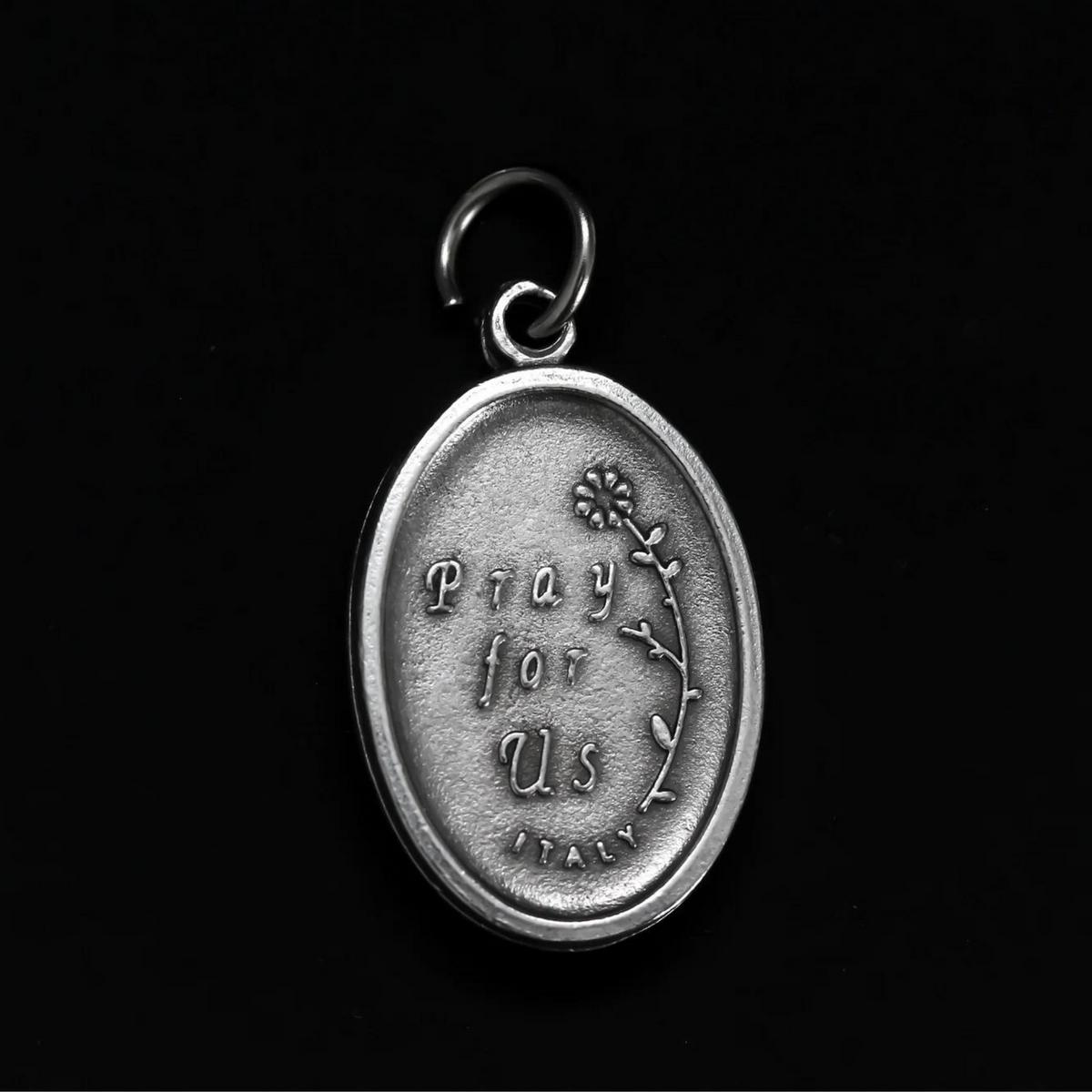 Maria Rosa Mystica medal that is marked "Pray for us" on the backside