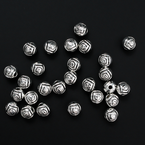 Antiqued silver-tone metal beads with a rosebud pattern 6.6mm in diameter, 60 beads total.