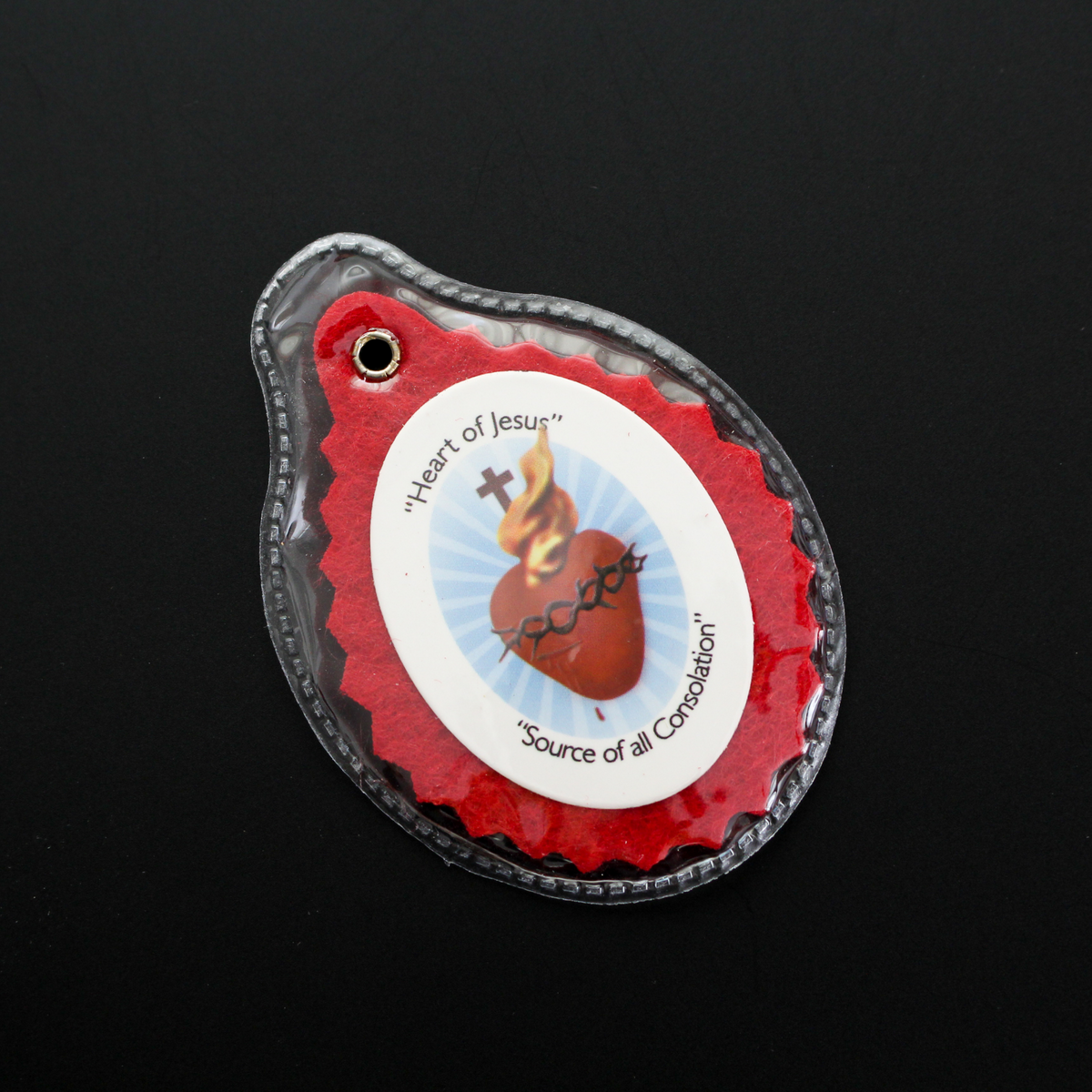 Official Badge of the Sacred Heart League. The badge is enclosed in a clear plastic case for durability and comfort. 