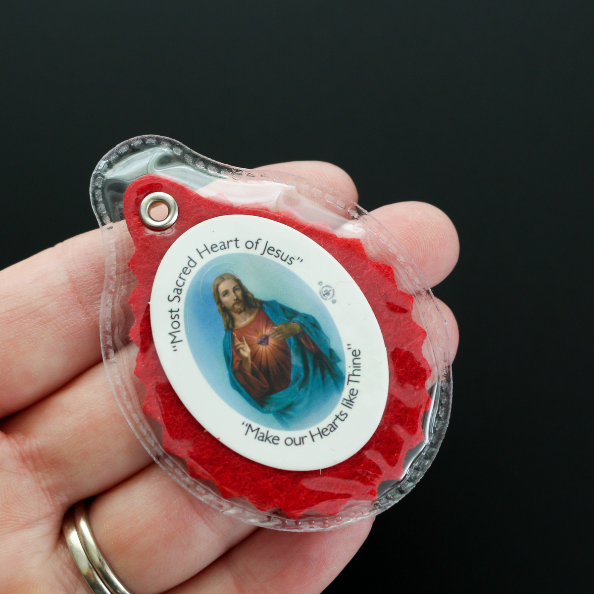 Official Badge of the Sacred Heart League. The badge is enclosed in a clear plastic case for durability and comfort. 