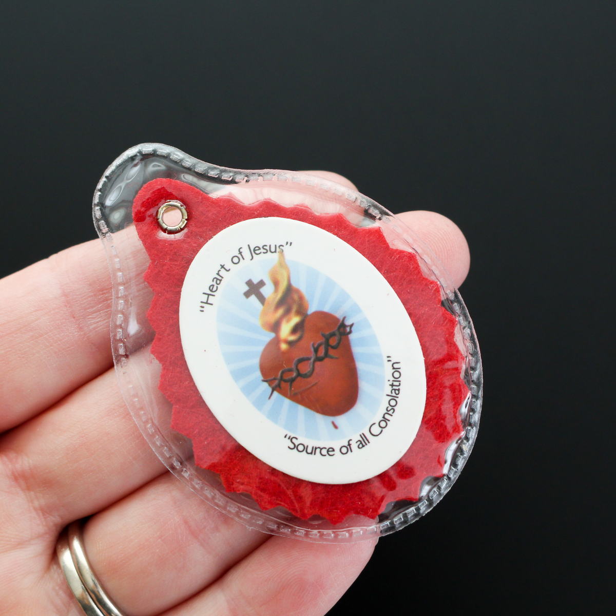 Official Badge of the Sacred Heart League. The badge is enclosed in a clear plastic case for durability and comfort. 