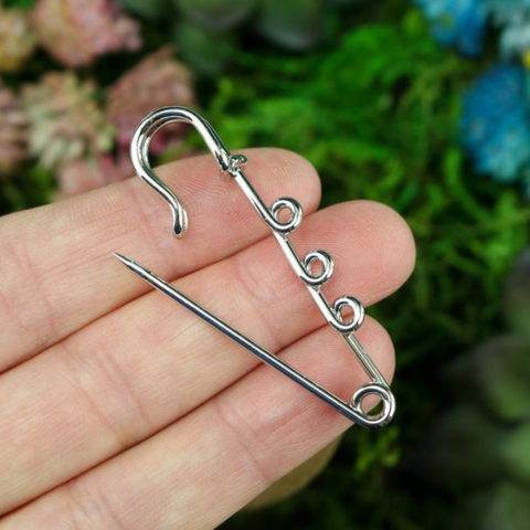 silver tone safety pin brooch with three connector loops