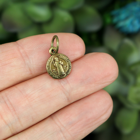 tiny round saint benedict medal brass color