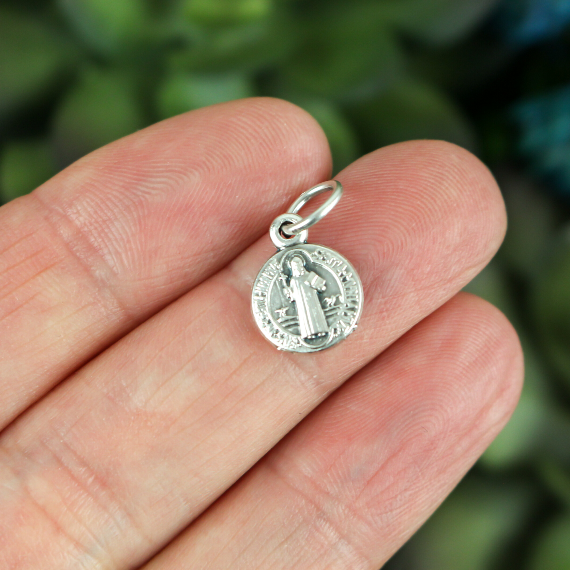 tiny round saint benedict medal silver color