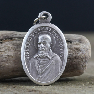 die cast silver medal depicting patron saint francis de sales