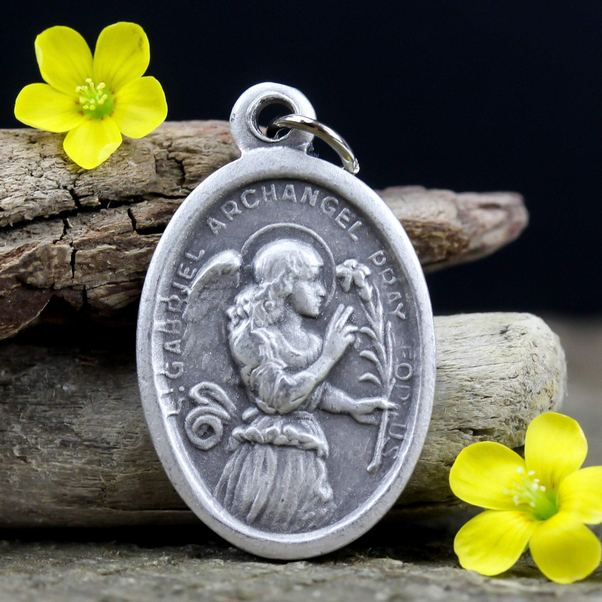 die cast silver medal depicting saint gabriel archangel