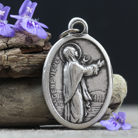 die cast silver tone medal depicting Saint Genevieve