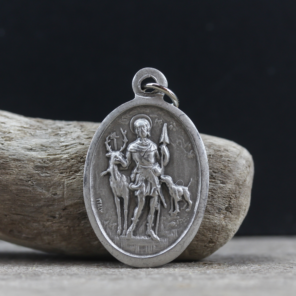 saint hubert silver oxidizied one inch oval medal marked pray for us on the back