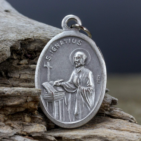 die cast silver medal depicting patron Saint Ignatius of Loyola