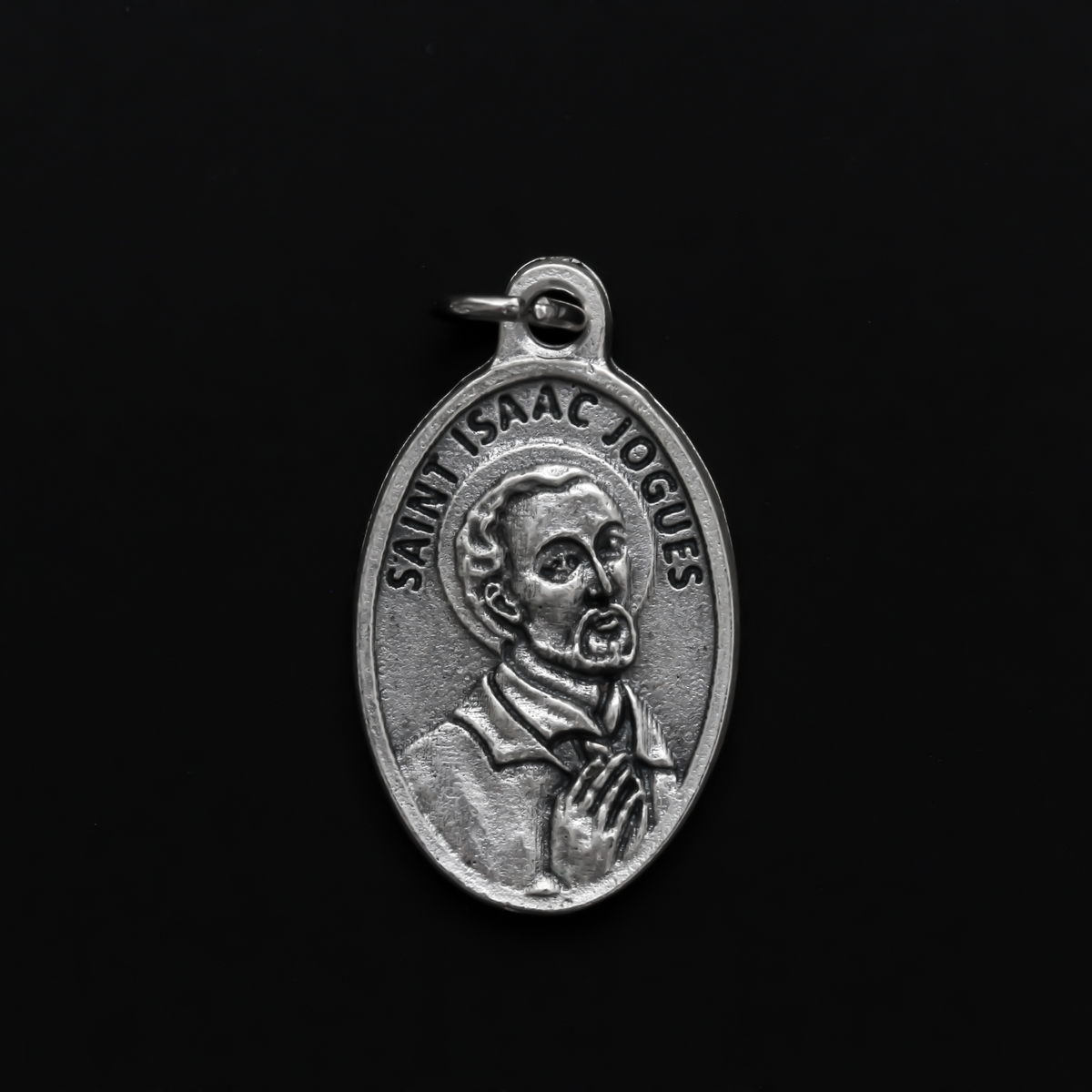 Saint Isaac Jogues medal that depicts the saint on the front and the words "Pray for us" on the back