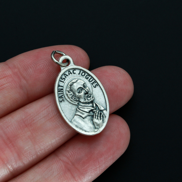 Saint Isaac Jogues medal that depicts the saint on the front and the words "Pray for us" on the back