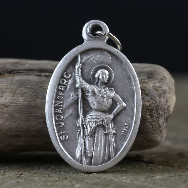 die cast silver medal depicting patron saint joan of arc