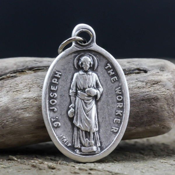die cast silver medal depicting patron saint joseph the worker