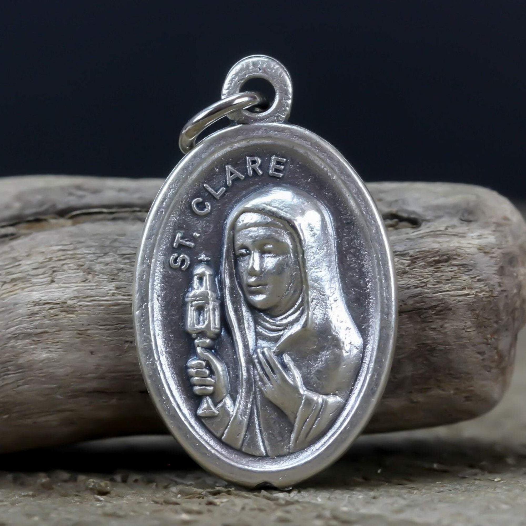 die cast silver saint clare one inch oval medal