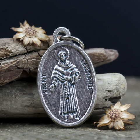 die cast silver medal depicting patron saint leonard