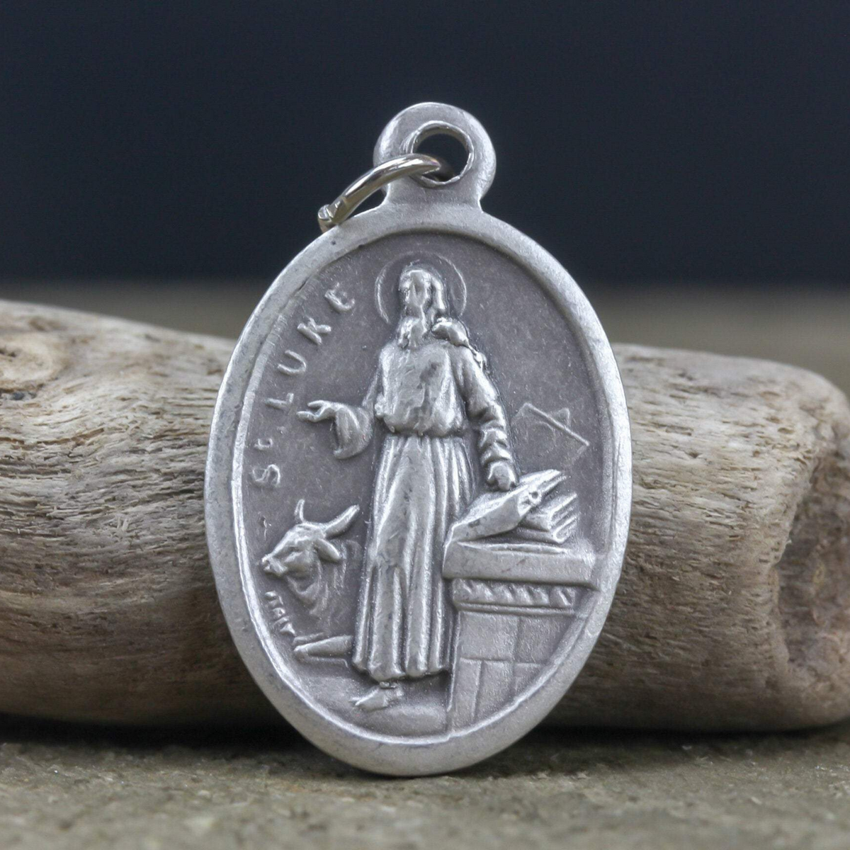 saint luke die cast one inch oval medal