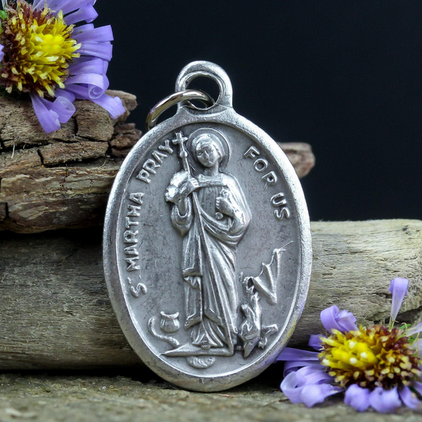 die cast silver medal depicting patron saint martha