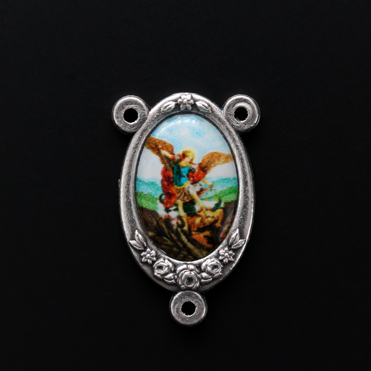 Rosary centerpiece that has a color image of Saint Michael inlaid in a silver oxidized Center with flower detailing along the edge
