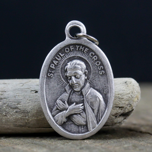 saint paul of the cross die cast silver tone one inch oval medal