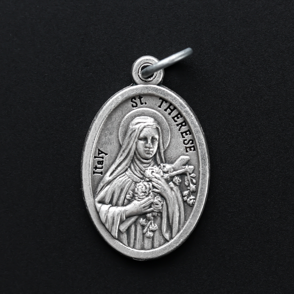 saint therese die-cast silver one inch oval medal