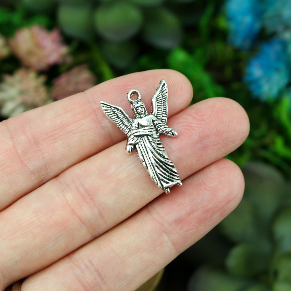 saint uriel figure shaped charm