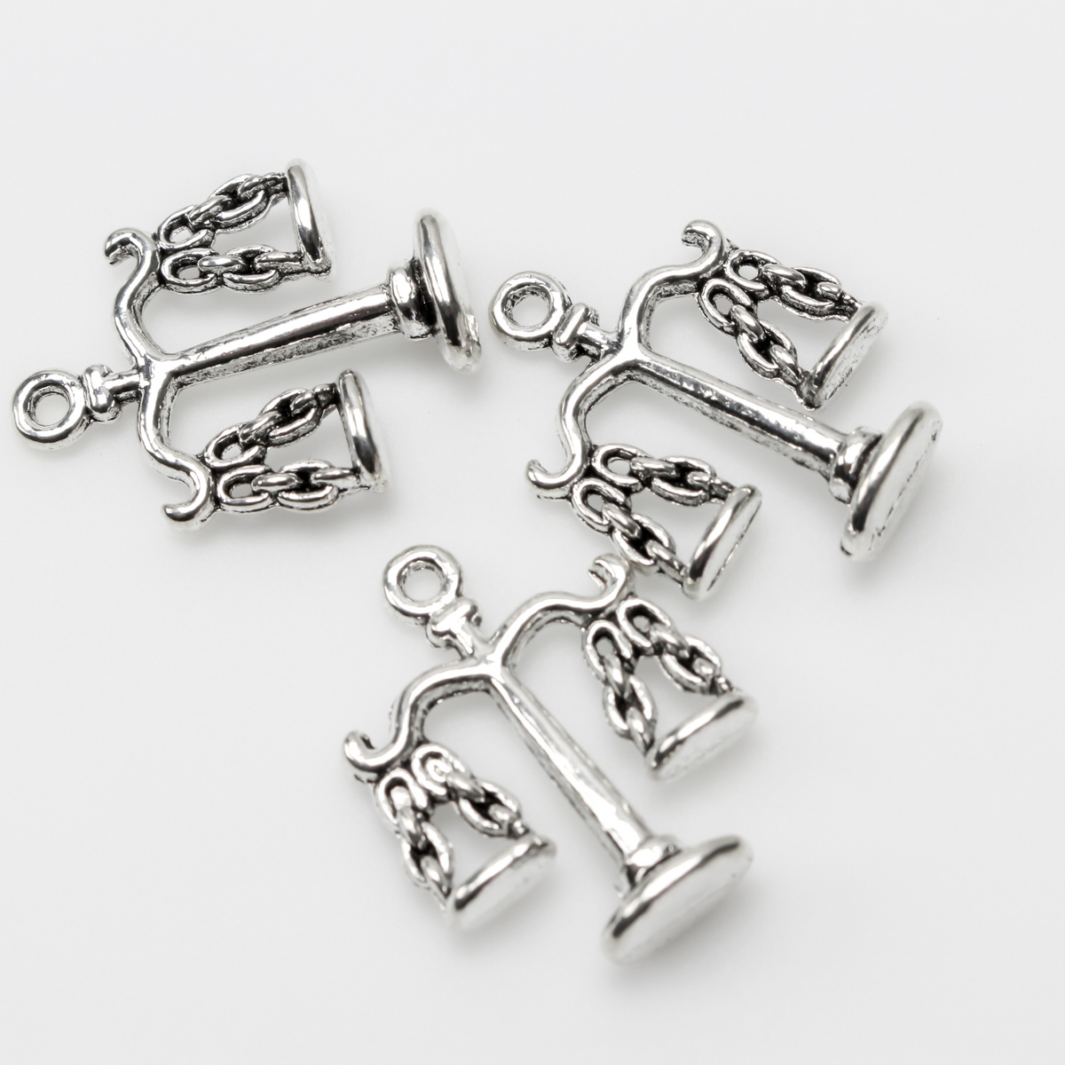 Scale of Justice charms in an antiqued silver tone color, 22mm long