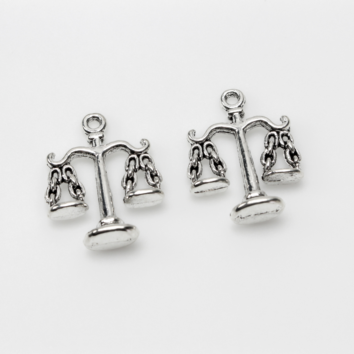 Scale of Justice charms in an antiqued silver tone color, 22mm long