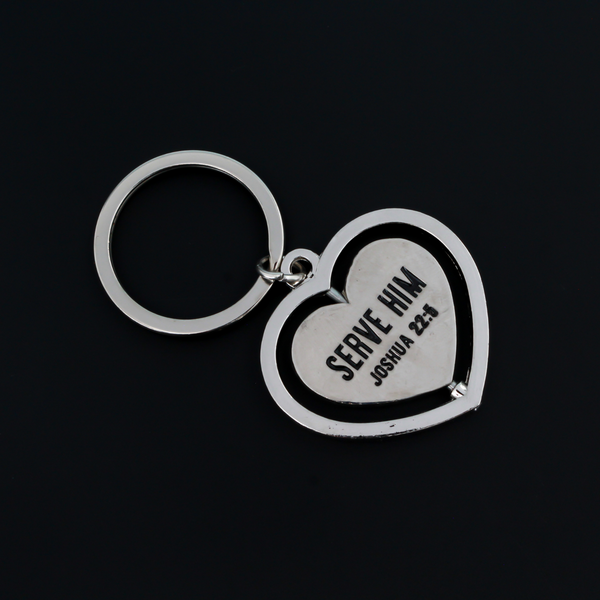 Serve with a heart like Jesus spinner key ring. The heart spins in a circle and both sides of the heart are engraved with "Serve Him Joshua 22:5".