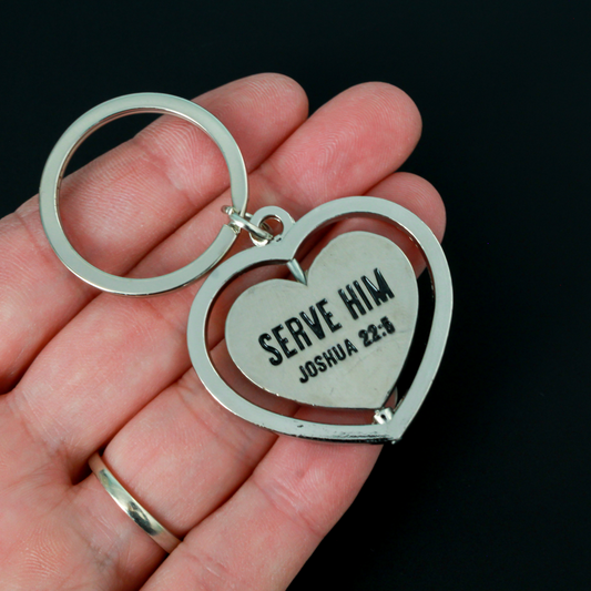 Serve with a heart like Jesus spinner key ring. The heart spins in a circle and both sides of the heart are engraved with "Serve Him Joshua 22:5".