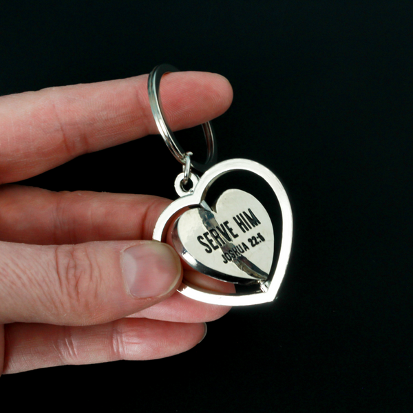 Serve with a heart like Jesus spinner key ring. The heart spins in a circle and both sides of the heart are engraved with "Serve Him Joshua 22:5".