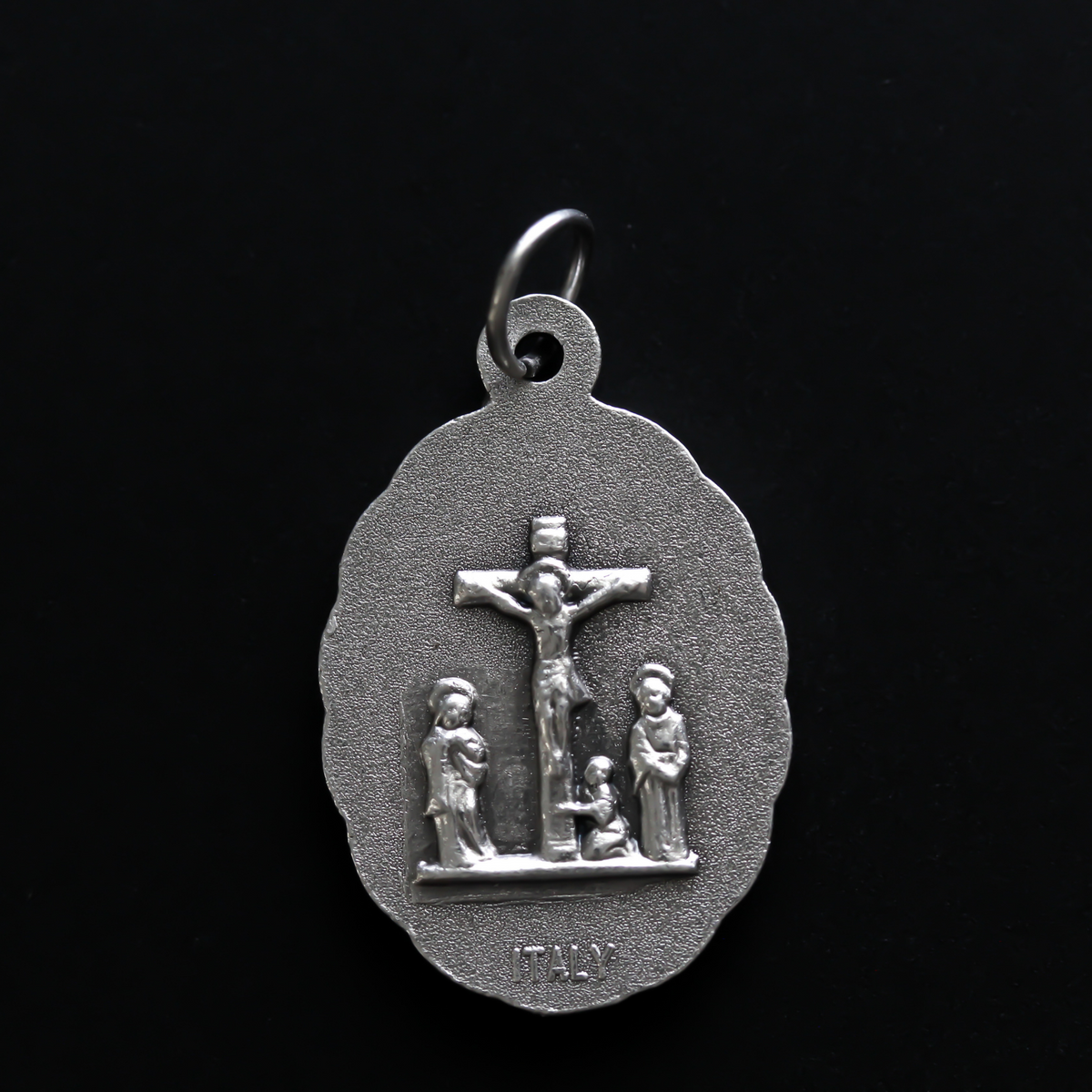 Our Lady of the Seven Sorrows medal that depicts the Virgin Mary on the front, her heart is pierced by seven swords which represent the seven sorrows.