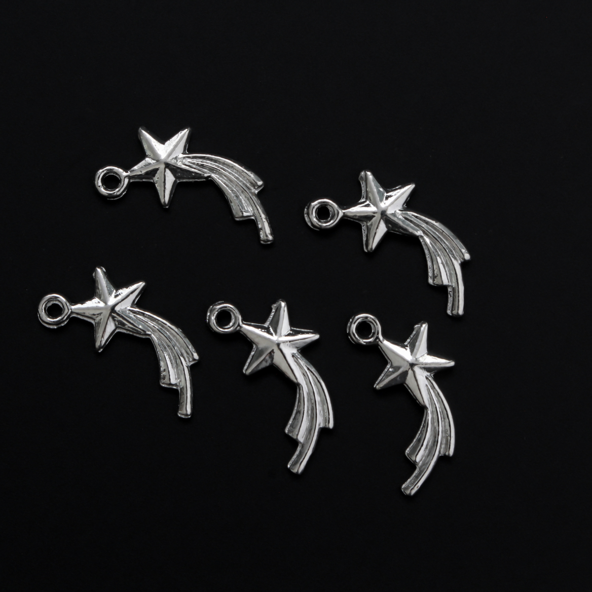 Tiny silver shooting star charms