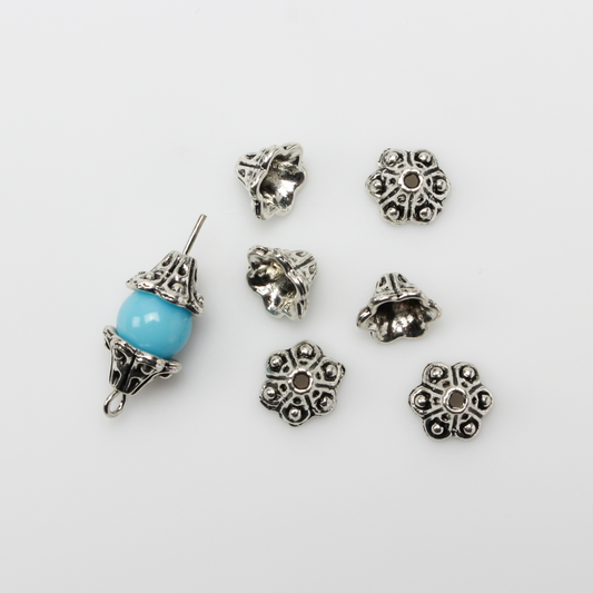 Bell flower shaped bead caps that will fit beads 8mm - 10mm. Shown on an 8mm glass bead for size reference. Sold in packages of 50 caps
