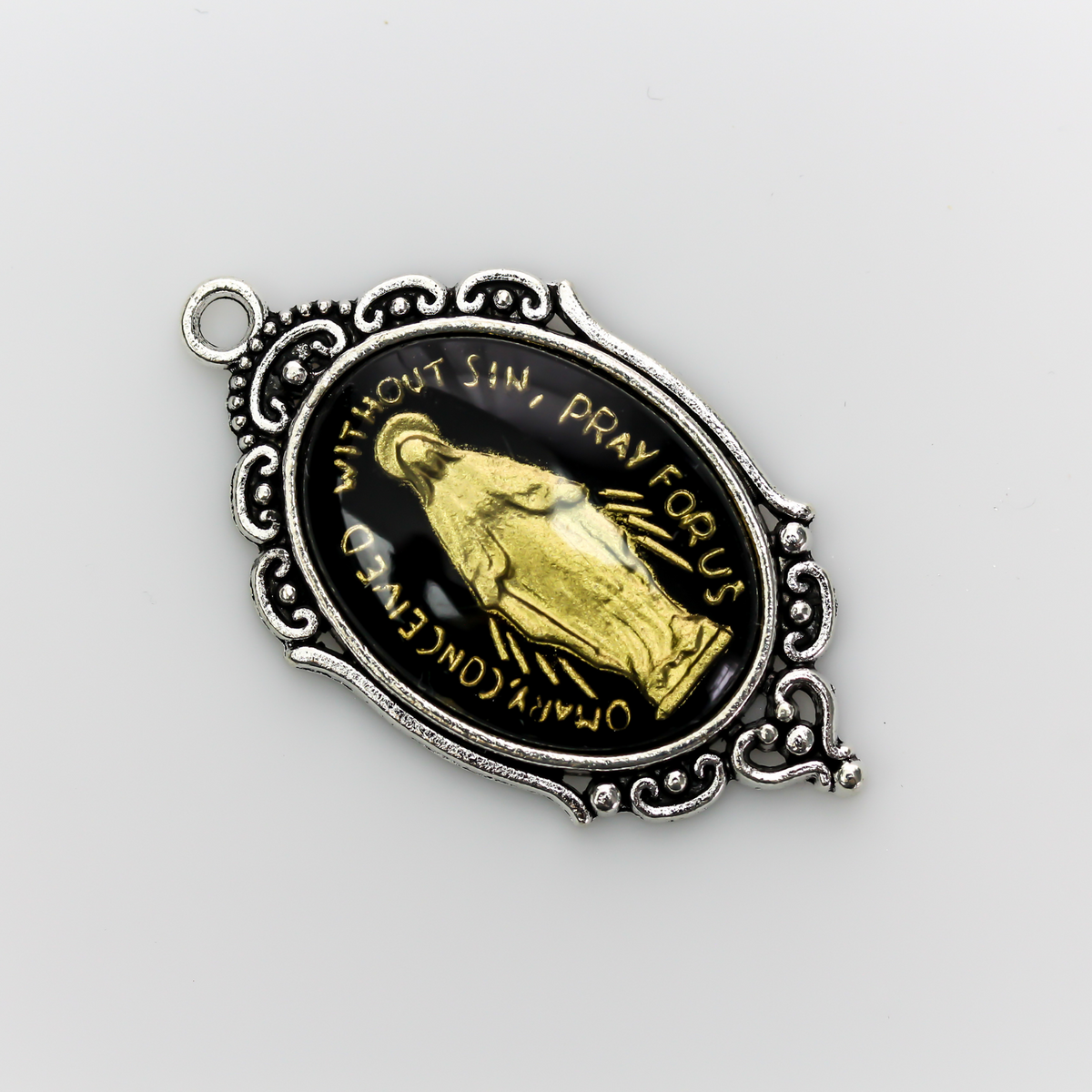 Ornate oval antiqued silver style cabochon setting with an open back