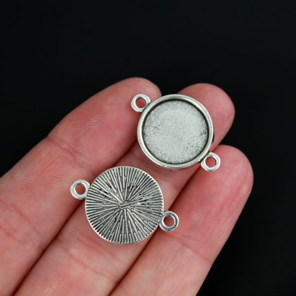 Antiqued silver bezel cup that has a bail on two sides which makes them perfect for connector links in bracelets or Pater beads on a rosary