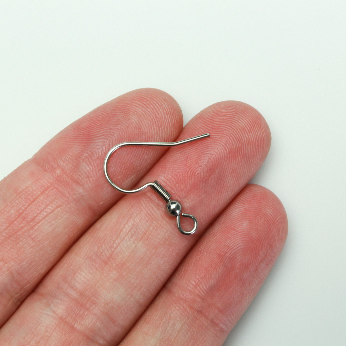 304 Stainless steel earring hooks with a horizontal loop, 22 guage wire. Sold in packages of 30 hooks (15 pairs).